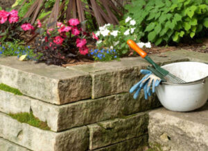 Is it cheaper to build a stone retaining wall or a brick retaining wall?